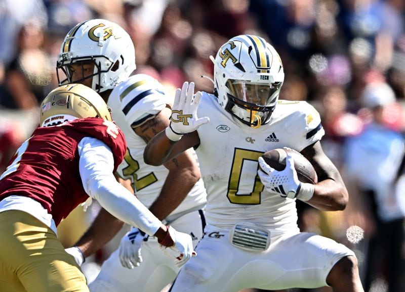 Georgia Tech running back Trey Cooley (0) runs past Boston College defensive back Elijah Jones (left) during the second half of an NCAA college football game at Georgia Tech's Bobby Dodd Stadium, Saturday, October 21, 2023, in Atlanta. Boston College won 38-23 over Georgia Tech. (Hyosub Shin / Hyosub.Shin@ajc.com)