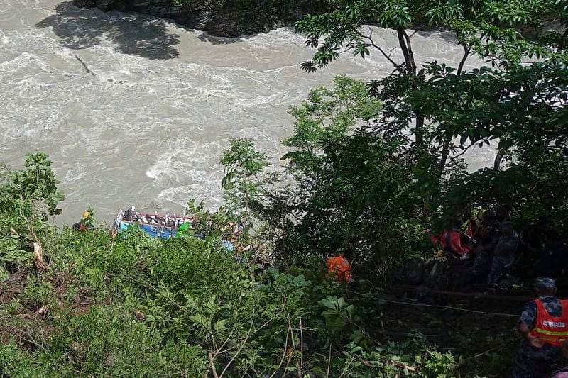 This photograph provided by Nepal Armed Police Force (APF) shows APF personnel carrying out rescue operation after a bus carrying Indian pilgrims fell into a river near Abukhaireni town, about 75 miles west of the capital, Kathmandu, Nepal, Friday, Aug. 23, 2024. (Nepal Armed Police Force via AP)