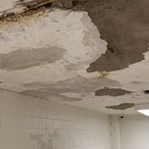 A plaster ceiling at Druid Hills High before it was repaired. After community outcry and state intervention last year over conditions at the school, the DeKalb County School District repaired many of the 96-year-old building's problems. (Courtesy of DeKalb County School District)