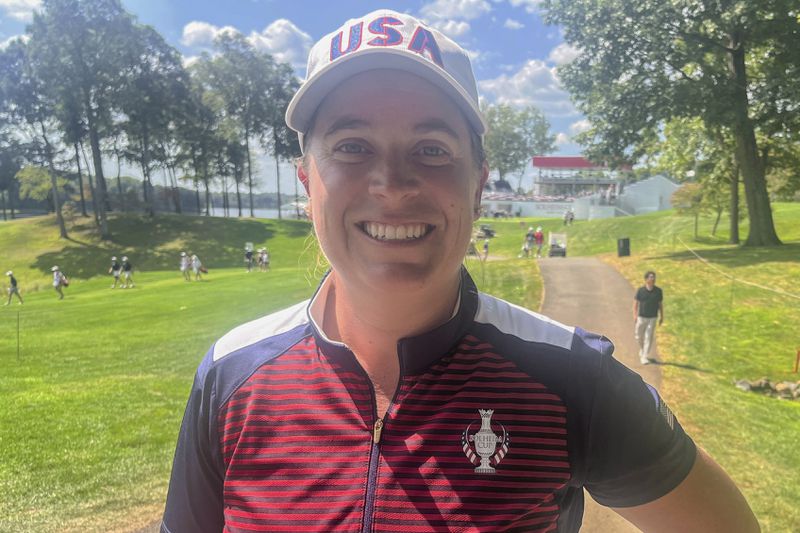 Lauren Coughlin poses for a photo near the first hole at Robert Trent Jones Golf Club in Gainesville, Va., on Wednesday, Sept. 11, 2024. (AP Photo/Ben Nuckols)