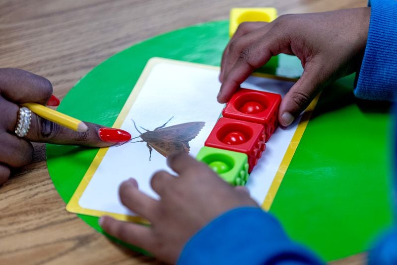 Shanterus Rose uses "pop its" to help her first grade students sound out words at Kimberly Elementary School on Tuesday, Dec. 5, 2023. Kimberly is one of eight Atlanta Public Schools that piloted a literacy program based on the "science of reading." (Steve Schaefer/AJC)