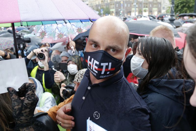 FILE - Opposition activist Andrei Pivovarov attends a rally to collect signatures against the results of a referendum on amendments to the Russian constitution in Moscow, Russia, on July 15, 2020. (AP Photo/Alexander Zemlianichenko, File)