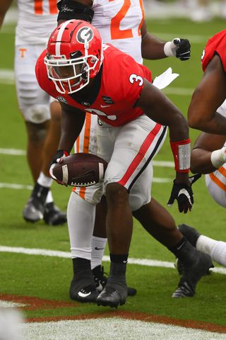 Georgia running back Zamir White gets up after scoring their first touchdown of the day against Tennessee during the first half of a football game Saturday, Oct. 10, 2020, at Sanford Stadium in Athens. JOHN AMIS FOR THE ATLANTA JOURNAL- CONSTITUTION