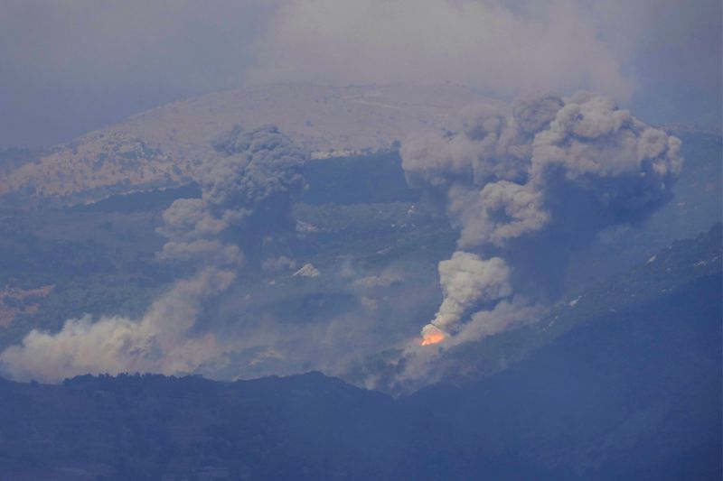 Smoke rises from Israeli airstrikes on Mahmoudiyeh mountains, as seen from Marjayoun town, south Lebanon, Saturday, Sept. 21, 2024. (AP Photo/Hussein Malla)