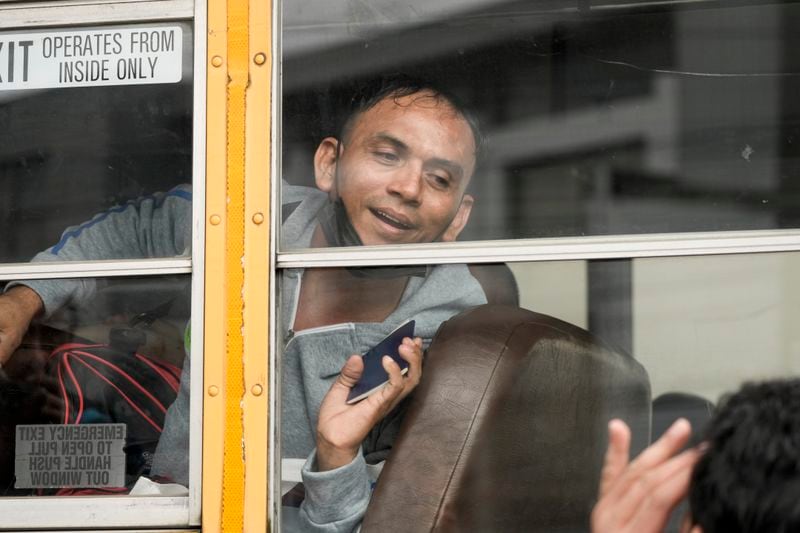 Nicaraguan citizens ride a bus after being released from a Nicaraguan jail and landing at the airport in Guatemala City, Thursday, Sept. 5, 2024. (AP Photo/Moises Castillo)