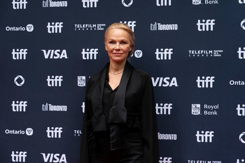 Pamela Anderson stands on the red carpet for the premiere of "The Last Showgirl" at the Princess of Wales Theatre, during the Toronto International Film Festival, in Toronto, Friday Sept. 6, 2024. (Paige Taylor White/The Canadian Press via AP)