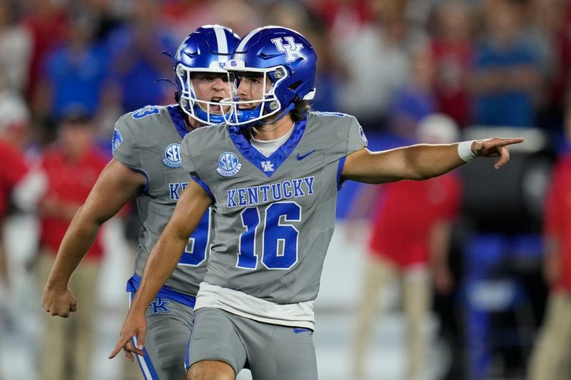 Kentucky place kicker Alex Raynor (16) and Wilson Berry celebrate a field goal by Raynor during the second half of an NCAA college football game against Georgia, Saturday, Sept. 14, 2024, in Lexington, Ky. (AP Photo/Darron Cummings)