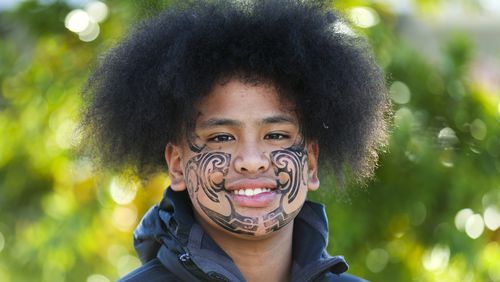 Perceus Samuels smiles after having his face painted during Matariki Whanau Day at the Wainuiomata Community Hub, Wellington, New Zealand on June 22, 2024. Now in its third year as a nationwide public holiday in New Zealand, Matariki marks the lunar new year by the rise of the star cluster known in the Northern Hemisphere as the Pleiades. (AP Photo/Hagen Hopkins)