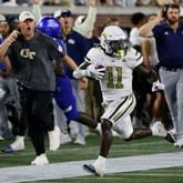 Georgia Tech Yellow Jackets running back Jamal Haynes (11) runs for a long game, as Tech coach Brent Key watches, to set up Tech's second score in a NCAA football game between the Georgia State Panthers and Georgia Tech at Bobby Dodd Stadium in Atlanta on Saturday, Aug. 31, 2024.  (Bob Andres for The Atlanta Journal-Constitution)