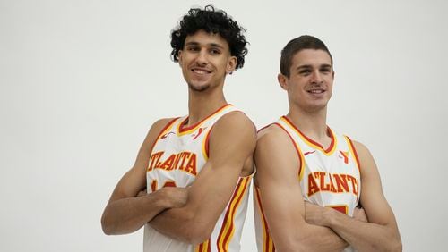Atlanta Hawks' Zaccharie Risacher, left and Nikola Djurišić, right, poses for a photograph after a news conference, Friday, June 28, 2024, in Atlanta. Risacher was selected as the first overall pick by the Atlanta Hawks in the first round of the NBA basketball draft. AP Photo/Brynn Anderson)