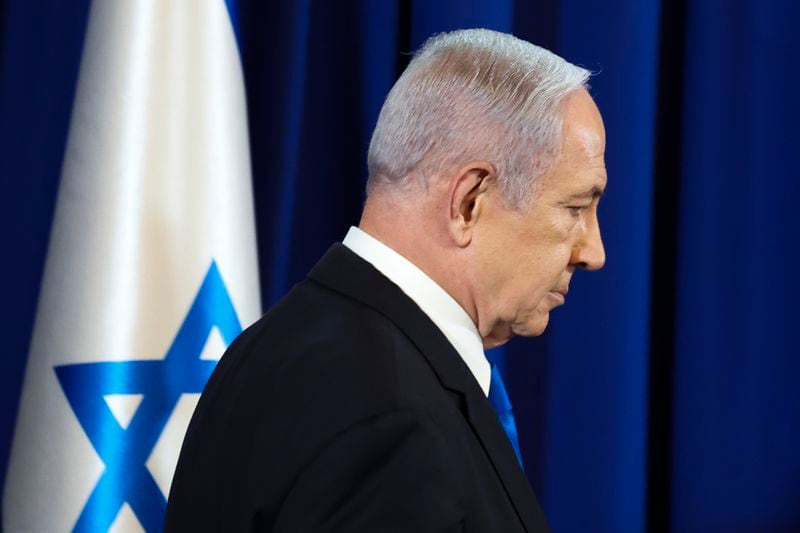 Israeli Prime Minister Benjamin Netanyahu arrives to speak during a press conference in Tel Aviv, Israel, Saturday July 13, 2024. (Nir Elias/Pool Photo via AP)