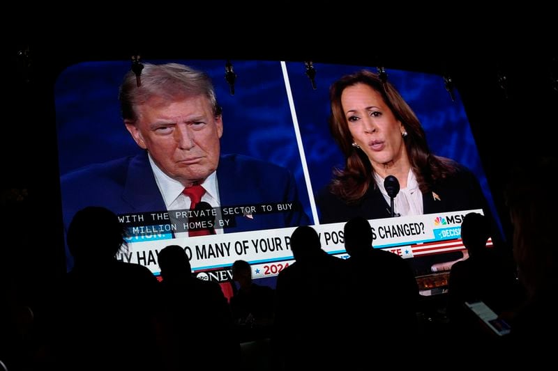 People watch the presidential debate between Republican presidential nominee former President Donald Trump and Democratic presidential nominee Vice President Kamala Harris, Tuesday, Sept. 10, 2024, at the Gipsy Las Vegas in Las Vegas. (AP Photo/John Locher)