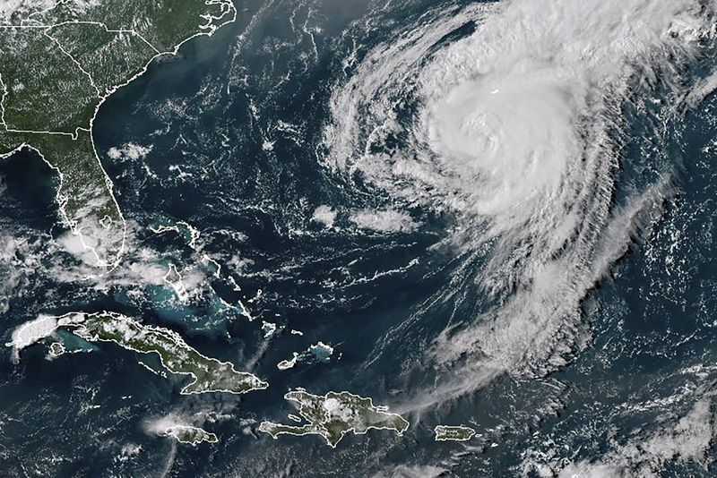 This GOES-16 GeoColor satellite image taken at 4:40 p.m EDT and provided by National Oceanic and Atmospheric Administration (NOAA) shows Hurricane Ernesto in the Atlantic Ocean south-southwest of Bermuda, Friday, Aug. 16, 2024. (NOAA via AP)