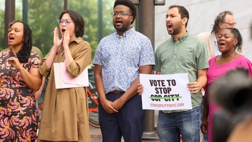 Protestors of Cop City cheer as a part of the ‘Vote to Stop Cop City’ coalition during a press conference to launch a referendum campaign to put Cop City on the ballot outside of Atlanta City Hall, Wednesday, June 7, 2023, in Atlanta. (Jason Getz / Jason.Getz@ajc.com)