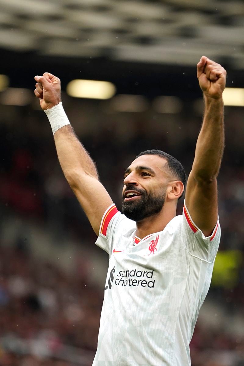 Liverpool's Mohamed Salah celebrates after scoring his side's third goal during the English Premier League soccer match between Manchester United and Liverpool at Old Trafford, Sunday, Sept. 1, 2024, in Manchester, England. (AP Photo/Dave Thompson)