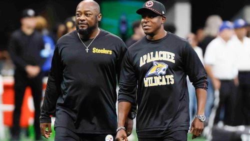 Falcons head coach Raheem Morris and the Pitsburg Steelers head coach Mike Tomlin interact moments before the game on Sunday, Sept. 8, at Mercedes-Benz Stadium in Atlanta. Falcons head coach wears an Apalachee High school shirt to support the recent events that shocked the community in Winder, Ga.
(Miguel Martinez/ AJC)