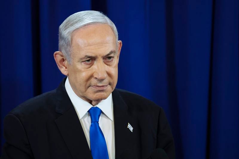 Israeli Prime Minister Benjamin Netanyahu pauses as he speaks during a press conference in Tel Aviv, Israel, Saturday July 13, 2024. (Nir Elias/Pool Photo via AP)