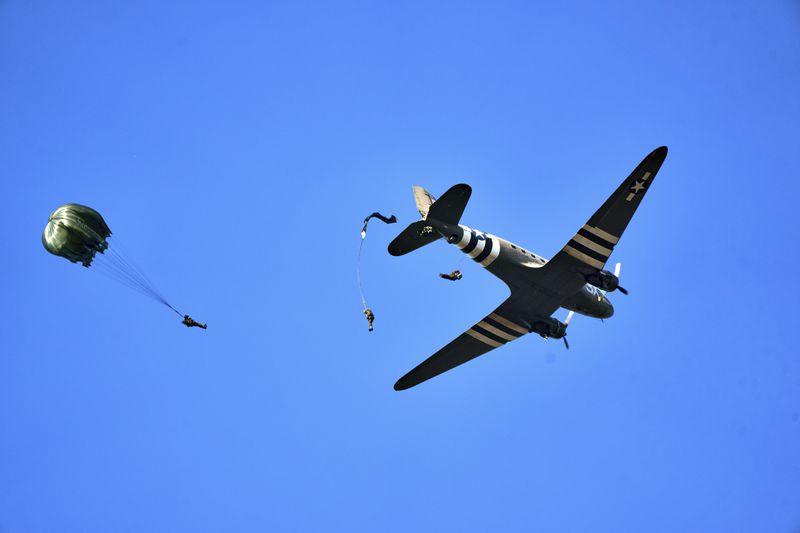 Parachutists jump over Ginkel Heath Netherlands, Saturday, Sept. 21, 2024, to mark the 80th anniversary of an audacious by unsuccessful World War II mission codenamed Market Garden to take key bridges in the Netherlands. (AP Photo/Phil Nijhuis)