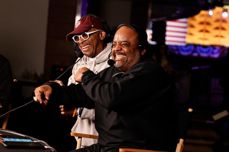 (Left to right) Filmmaker Spike Lee shares a laugh with journalist Roland Martin during the runoff election night watch party for Sen. Raphael Warnock at Atlanta Marriott Marquis on Tuesday, December 6, 2022. (Natrice Miller/natrice.miller@ajc.com)  