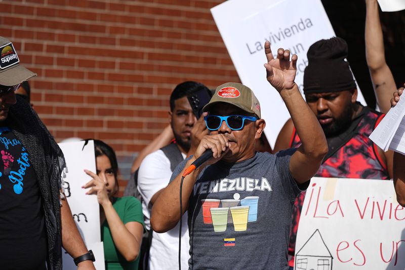 Resident Moises Didenot speaks during a rally staged by the East Colfax Community Collective to address chronic problems in the apartment buildings occupied by people displaced from their home countries in central and South America Tuesday, Sept. 3, 2024, in Aurora, Colo. (AP Photo/David Zalubowski)