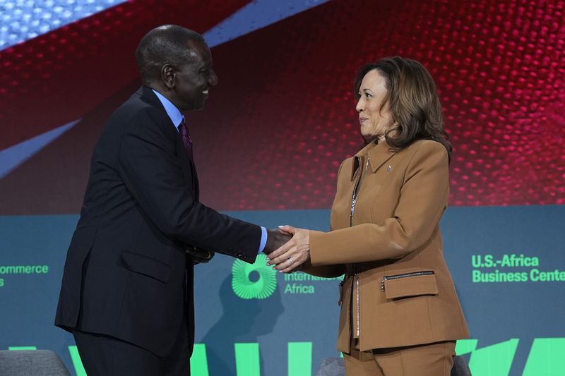 Kenya's President William Ruto, left, and Vice President Kamala Harris shake hands after participating in a discussion at the U.S.-Kenya Business Forum at the Chamber of Commerce in Washington, Friday, May 24, 2024. (AP Photo/Susan Walsh)