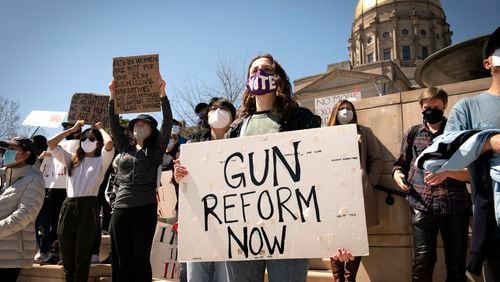 A woman advocating for stricter gun control laws on March 20, 2021, outside the Georgia state Capitol. (Robin Rayne/ZUMA Wire/TNS)