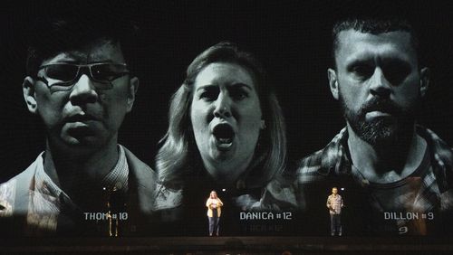 This image released by Opera Philadelphia shows Joseph Lim, from left, Diane Newman and John Moore, during a performance of "The Listeners." (Steven Pisano/Opera Philadelphia via AP)