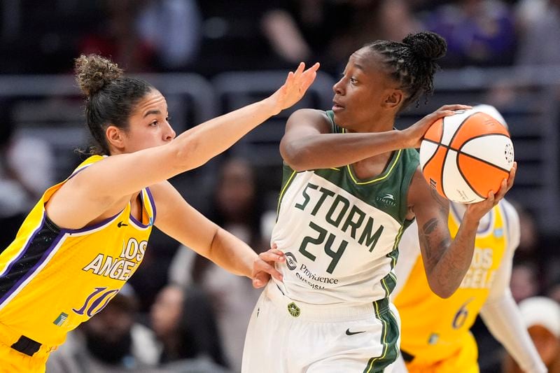 Seattle Storm guard Jewell Loyd, right, tries to pass as Los Angeles Sparks guard Kia Nurse defends during the second half of a WNBA basketball game, Wednesday, Sept. 11, 2024, in Los Angeles. (AP Photo/Mark J. Terrill)