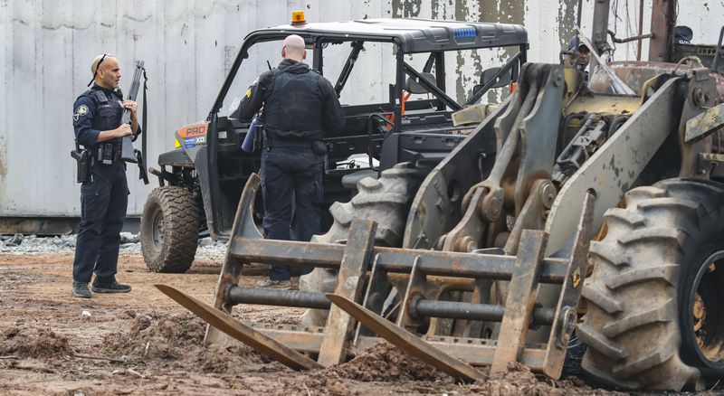 March 6, 2023 Atlanta: Atlanta police and construction personnel were on the construction site of the police training center Monday morning, March 6, 2023 in Atlanta examining equipment set on fire and destroyed by violent protests the day before. Meanwhile, an activist group called “Stop Cop City” said it was officers who started the violence by raiding a nearby music festival, a news release from the group states. Some of the violence at the Atlanta Public Safety Training Center site, located near Bouldercrest Road and Key Road in DeKalb County, was captured on surveillance cameras and released by Atlanta police. Several pieces of construction equipment were set on fire, Atlanta police Chief Darin Schierbaum said during a news conference. Other police agencies stepped in to assist the city’s officers.(John Spink / John.Spink@ajc.com)

