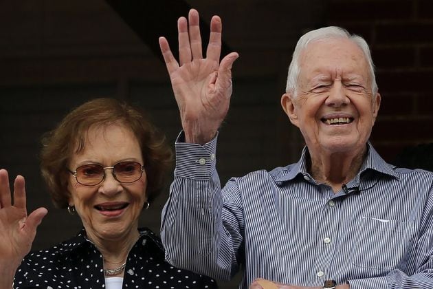 Former President Jimmy Carter and first lady Rosalynn Carter wave to a beauty queen during the Peanut Festival on Saturday Sept. 26, 2015, in Plains. The former president has been in hospice care since February 2023. Rosalynn Carter passed away in November. (Ben Gray/The Atlanta Journal-Constitution/TNS)