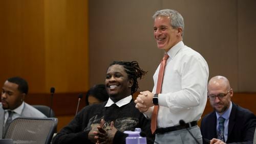 Defense attorney Brian Steel and his client, rapper Young Thug, react moments before his trial enters the second week at Fulton County Courthouse on Monday, Dec. 4, 2023.
Miguel Martinez /miguel.martinezjimenez@ajc.com