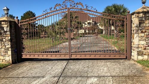 At the same time FIFA official Jeffrey Webb purchased his mansion in Loganville, Canover Watson, one of Webb’s business associates in the Cayman Islands, bought this one next door. Watson still owns the home, which now appears to be vacant.