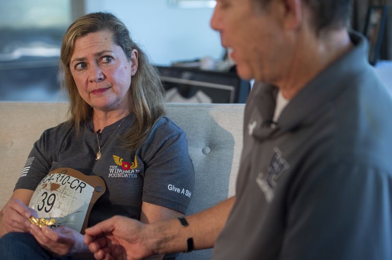 Bart Collart, right, and his wife Alexia Collart, talk about their son, Marine Corporal Spencer R. Collart, at their home, in Arlington, Va., Thursday, June 19, 2024. Their son was killed along with two other Marines when the MV-22B Osprey aircraft they were on crashed during drills on a north Australian island on August 27, 2023. (AP Photo/Rod Lamkey, Jr.)