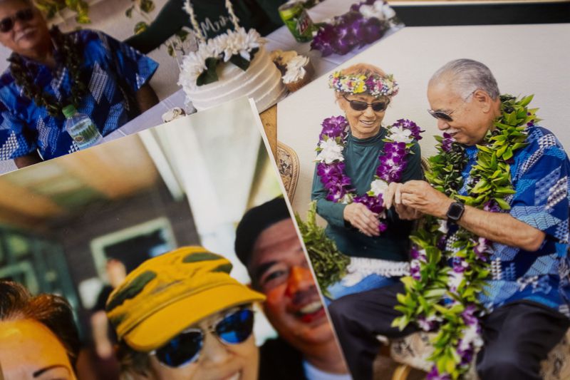 FILE - Photos of Sharlene Rabang, who was named as the 100th victim of the Lahaina wildfires after dying weeks after fleeing her home, Tuesday, Dec. 5, 2023, are seen at her husband Weslee Chinen's family home in Waipahu, Hawaii. (AP Photo/Lindsey Wasson)