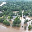 An aerial view shows the Vinings area and the Lovett School on Sept. 27, after the Chattahoochee River flooded in the aftermath of Hurricane Helene. (Miguel Martinez/AJC)