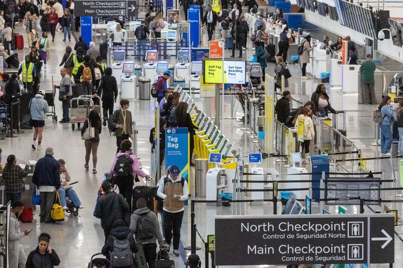 Travelers make their way through  Hartsfield-Jackson Atlanta International Airport on Wednesday, Nov. 22, 2023. An estimated 85,000 travelers were expected to pass through the airport the day before Thanksgiving.  (Steve Schaefer/steve.schaefer@ajc.com)