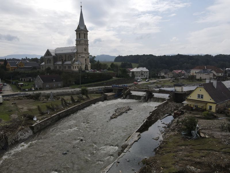 A view of a damaged village of Mikulovice as residents return to clean after recent floods in Czech Republic, Thursday, Sept. 19, 2024. (AP Photo/Petr David Josek)