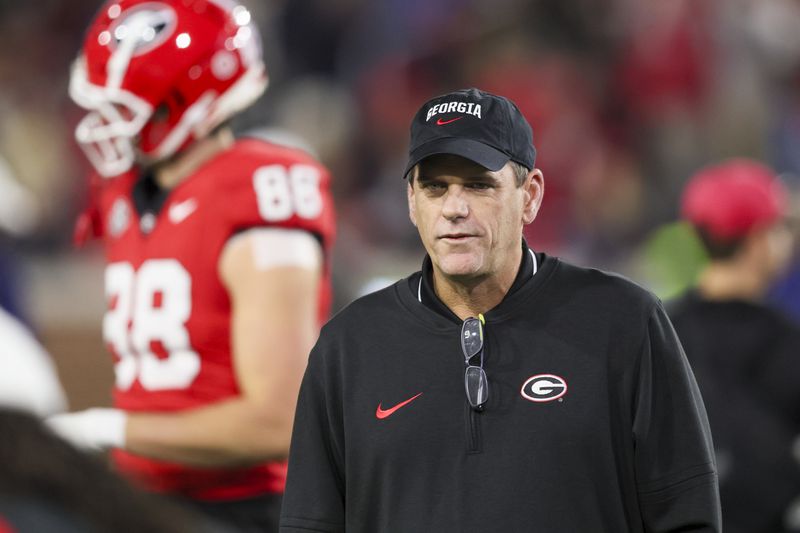 Georgia offensive coordinator Mike Bobo watches warm-ups before Georgia’s game against Georgia Tech at Bobby Dodd Stadium, Saturday, November 25, 2023, in Atlanta. (Jason Getz / Jason.Getz@ajc.com)