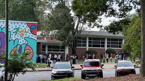 Students wait outside Cross Keys High School on Wednesday, Aug. 9, 2023, to go through the district's new Evolv weapons detection system before classes start. By the time the school day started, there was no line. (Cassidy Alexander/cassidy.alexander@ajc.com)