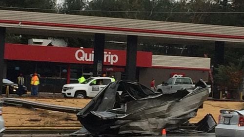 A QuikTrip is closed off Mableton Parkway after a piece of roofing fell into the roadway.