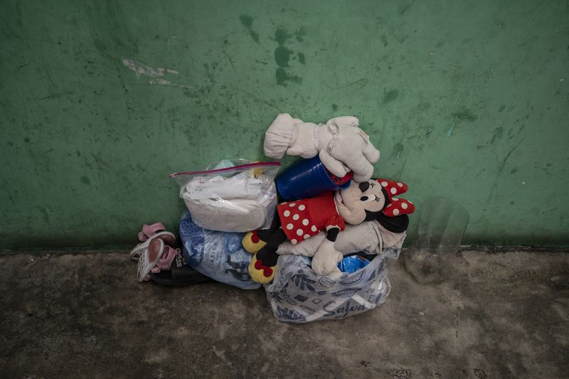 A Venezuelan migrant girl's belongings lay on the floor at the Peace Oasis of the Holy Spirit Amparito shelter in Villahermosa, Mexico, Friday, June 7, 2024. After the head of Mexico's immigration agency ordered a halt to deportations in December, migrants have been left in limbo as authorities round up migrants across the country and dump them in the southern Mexican cities of Villahermosa and Tapachula. (AP Photo/Felix Marquez)