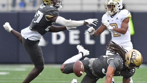 September 19, 2020 Atlanta - University of Central Florida's defensive back Richie Grant (27) and University of Central Florida's defensive back Aaron Robinson (31) try to block a pass intended to Georgia Tech's wide receiver Ahmarean Brown (2) during the second half of an NCAA college football game at Georgia Tech's Bobby Dodd Stadium in Atlanta on Saturday, September 19, 2020. UCF won 49-21 over the Georgia Tech. (Hyosub Shin / Hyosub.Shin@ajc.com)