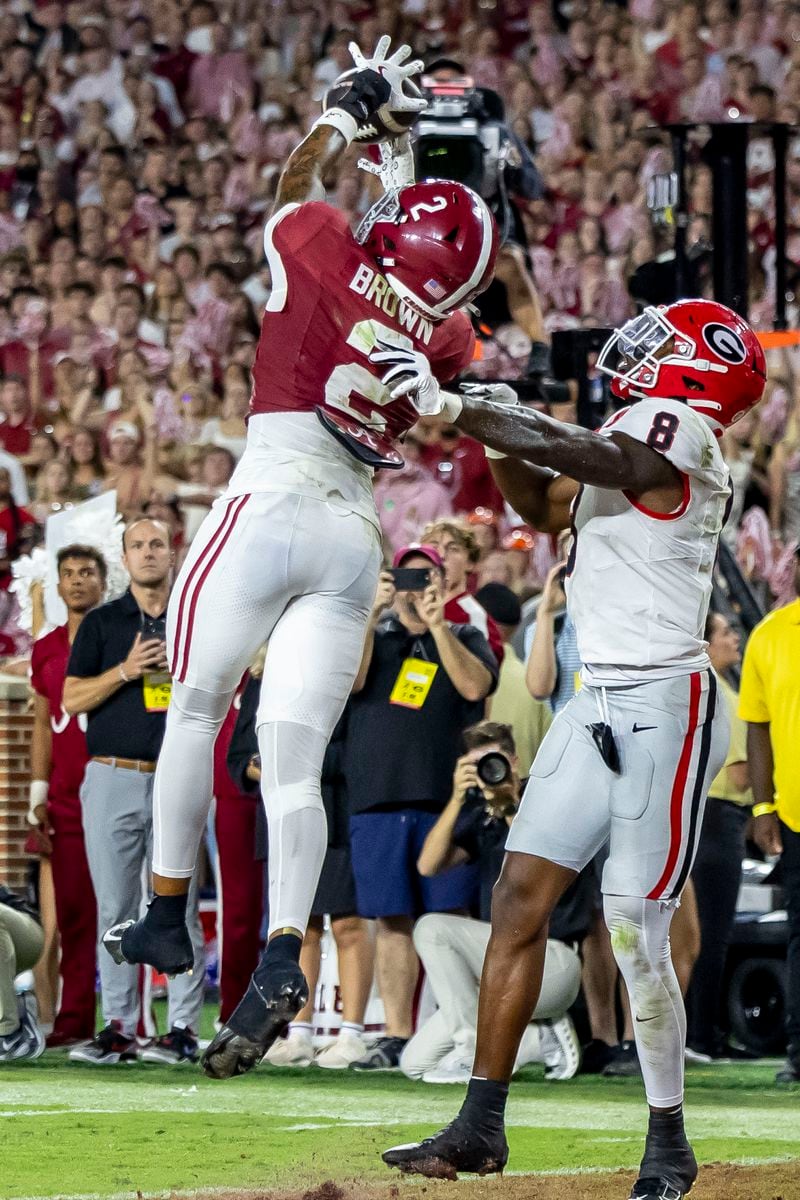 Alabama defensive back Zabien Brown (2) makes the game-clinching interception in front of Georgia wide receiver Colbie Young (8) in the final minute of the second half of an NCAA college football game, Saturday, Sept. 28, 2024, in Tuscaloosa, Ala. (AP Photo/Vasha Hunt)