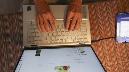 Barbara Winston uses a computer at her home in Northbrook, Ill., on Sunday, June 30, 2024, several days after taking an introduction to artificial intelligence class at a local senior center. (AP Photo/Teresa Crawford)