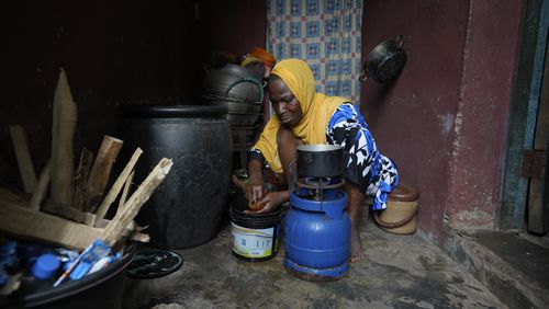 Idowu Bello, 56, prepares a meal in her kitchen in Ibadan, Nigeria, Friday, Sept. 13, 2024. (AP Photo/Sunday Alamba)