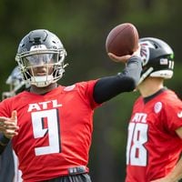 Falcons quarterback Michael Penix Jr. (9) practices during training camp at the Falcons’ headquarters in Flowery Branch on Friday, July 26, 2024. (Arvin Temkar / AJC)