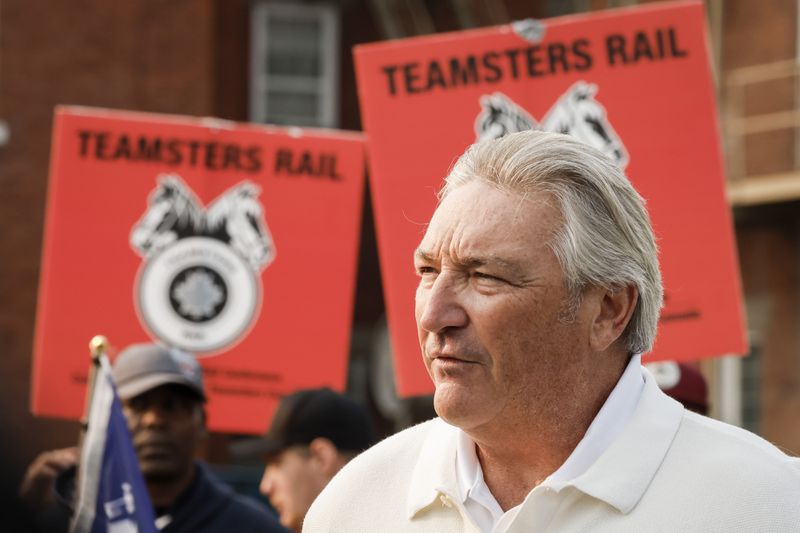 Francois Laporte, National President, Teamsters Canada, speaks to media as picketing rail workers gather at the CPKC headquarters in Calgary, Alta., Friday, Aug. 23, 2024.(Jeff McIntosh /The Canadian Press via AP)