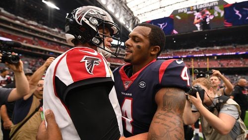 Falcons quarterback Matt Ryan and Houston's Deshaun Watson meet after the game Oct. 6, 2019, at NRG Stadium in Houston. The Falcons reportedly have shown some interest in Watson.