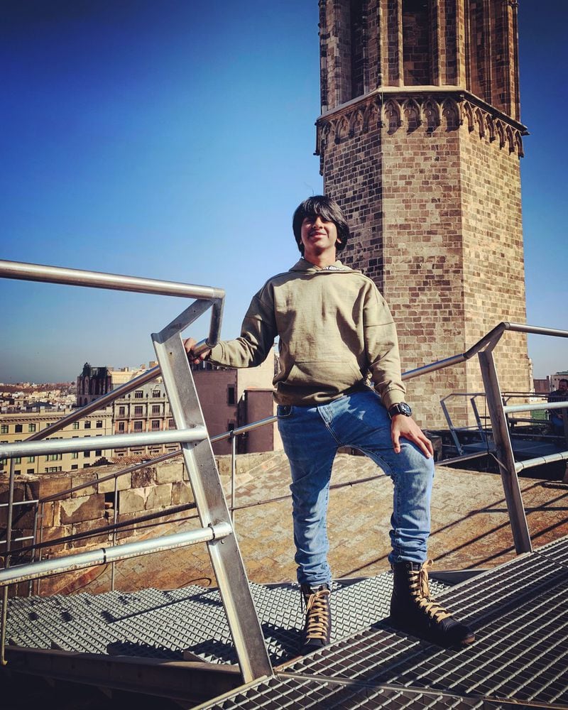 “These lessons he has learned from travel are ones that he could not have learned in a traditional classroom,” writes Atlanta chef Asha Gomez about her teenage son Ethan Gomez-Palayan, pictured here at the Sagrada Familia cathedral in Barcelona, Spain. CONTRIBUTED BY ASHA GOMEZ