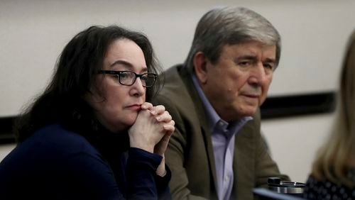 Rose Marie Kosmetatos, left, and her husband, Antonios Pagourtzis, parents of accused Santa Fe High School shooter Dimitrios Pagourtzis, listen to their attorneys discuss a motion Friday, Aug. 16, 2024, during their civil trial in Galveston County Court No. 3 Judge Jack Ewing's courtroom at the Galveston County Courthouse in Galveston, Texas. (Jennifer Reynolds/The Galveston County Daily News via AP, Pool)